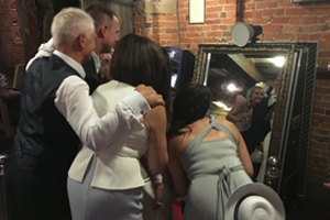 Guests at a wedding in Nottingham using the Magic Mirror Photo Booth