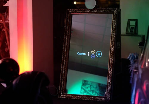 The magic mirror set up with mood lighting at an event in Nottingham