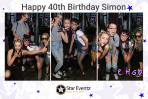 Guests enjoying the Selfie Mirror Booth with Props at Simon's 40th Birthday Party in Sheffield