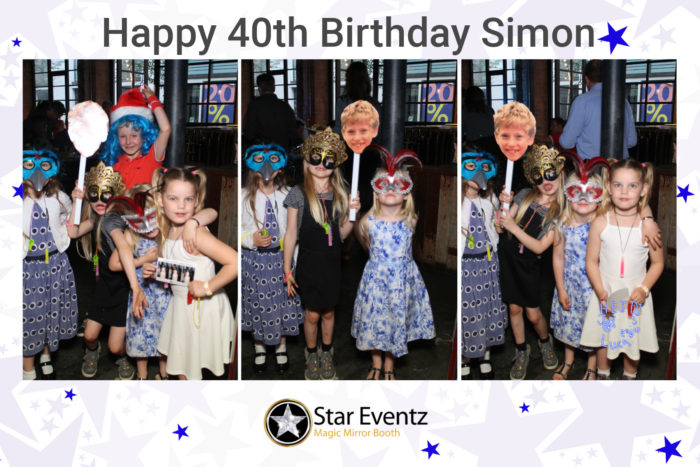 The kids enjoying the Selfie Mirror Booth with some props at Simon's 40th Birthday PaRTY in Sheffield